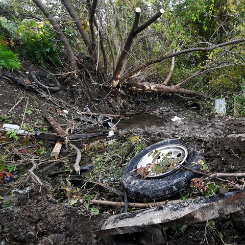 Debris scatters an area Oct. 7, 2018, at the site...