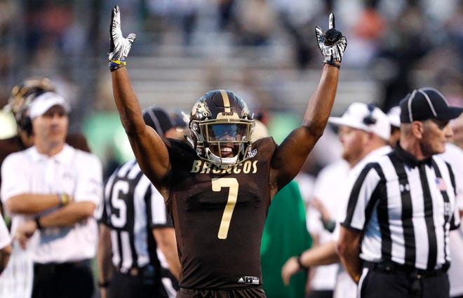 Western Michigan Broncos wide receiver D'Wayne Eskridge (7) celebrates after official review confirms his touchdown during the third quarter against the Syracuse Orange at Waldo Stadium.