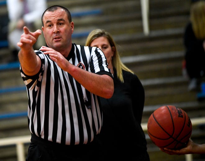 A referee motions a call to the players in a TSSAA girls basketball game between Gibson County and Sikeston (MO) in the Gibson County Christmas Tournament at Gibson County High School in Dyer, Tenn., on Thursday, Dec. 20, 2018.