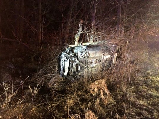 A Ford Focus rests on its side after an accident ended a police pursuit on Mineral Springs Road.
