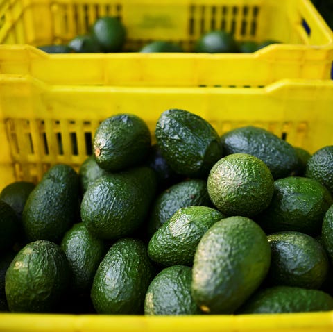 Fruit boxes with avocados are pictured during...
