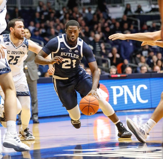 Butler University's guard/forward Jerald Gillens-Butler (21) drives past UC Irvine's guard Spencer Rivers (25) to the lane during a game between Butler University and UC Irvine, at Hinkle Fieldhouse on Friday, Dec. 21, 2018. 