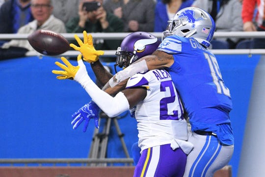 Lions wide receiver Kenny Golladay is unable to complete a pass as Vikings cornerback Mackensie Alexander break up the play during the first half on Sunday, Dec. 23, 2018, at Ford Field.
