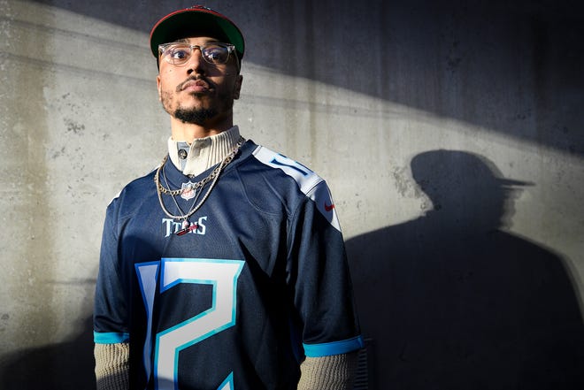 Boston Red Sox outfielder Mookie Betts waits to be introduced as the 12th Titan before the start of the Titans game against the Redskins at Nissan Stadium Saturday, Dec. 22, 2018, in Nashville, Tenn.