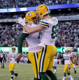 Green Bay Packers' Aaron Rodgers celebrates a 2-point conversion during the 2nd half of Packers 44-38 overtime win against the New York Jets at MetLife Stadium Sunday, Dec. 23, 2018, in East Rutherford.