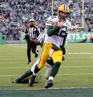 Green Bay Packers' Aaron Rodgers scores a touchdown during the 2nd half of Packers 44-38 overtime win against the New York Jets at MetLife Stadium Sunday, Dec. 23, 2018, in East Rutherford.