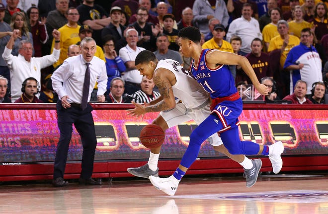 Arizona State recovers a loose ball as Rob Edwards and Kansas guard Devon Dotson chase late in the second half on Dec. 22 at Wells Fargo Arena.