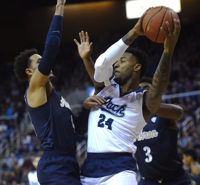 Nevada's Jordan Caroline (24) looks for room against the Akron defense Saturday afternoon at Lawlor Events Center.