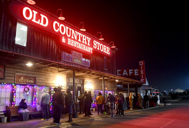 A line forms outside of the Old Country Store, Monday morning, for the 34th Annual Christmas Eve Breakfast. People began lining up around 3:30am to be the first in line for when the doors opened at 5:30am.