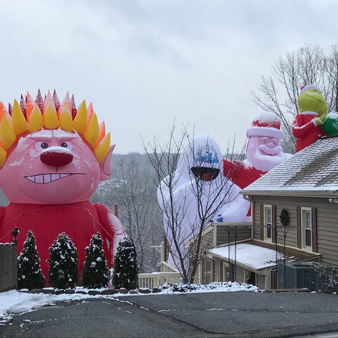 Bloomingdale Nj Christmas Decorations Tower Over Man S House Big Blow Up Christmas Decorations