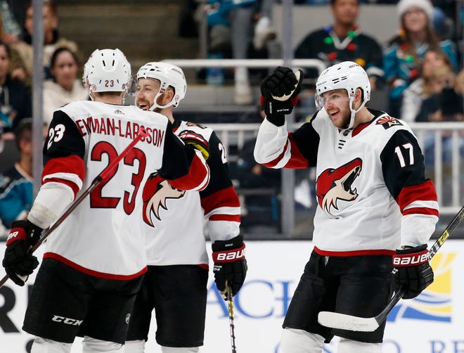 Arizona Coyotes' Alex Galchenyuk (17) celebrates with Oliver Ekman-Larsson (23) after scoring his second goal of the night against the San Jose Sharks in the second period of an NHL hockey game in San Jose, Calif., Sunday, Dec. 23, 2018. (AP Photo/Josie Lepe)