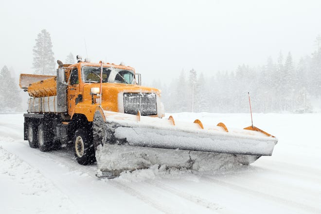 A Nevada Department of Transportation snowplow heads up the Mt. Rose Highway on Dec. 24, 2018. 