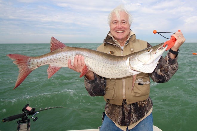 Lynn Henning holds the 38-inch muskie he landed from Lake St. Clair.
