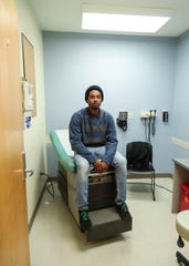 John Howard, 22, doesn't have health insurance but does get care at the Family Health Center on East Muhammad Ali. 