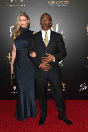Eddie Murphy and the mother of his 10th child, Paige Butcher, at the Hollywood Film Awards in 2016.