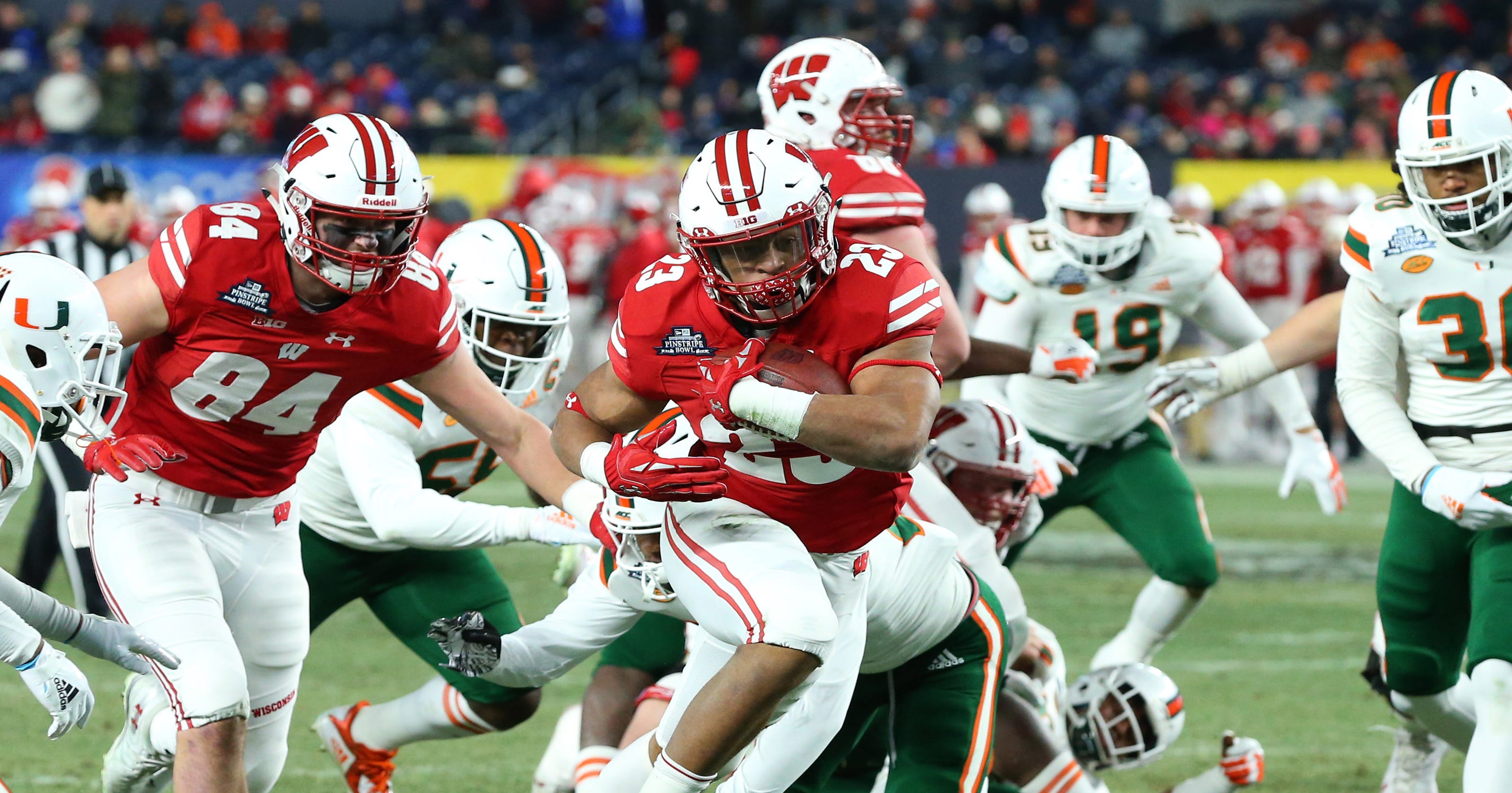 Pinstripe Bowl Wisconsin routs Miami behind Jonathan Taylor's effort