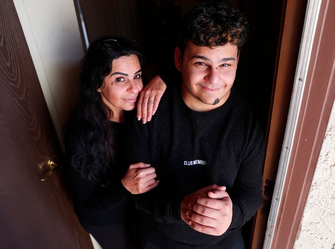 Mesa HS wrestler Ali Lateef with his mom, Fatima Hamed, December 18, 2018. Ali faced discrimination when he immigrated to the U.S. but has found new friends wrestling.