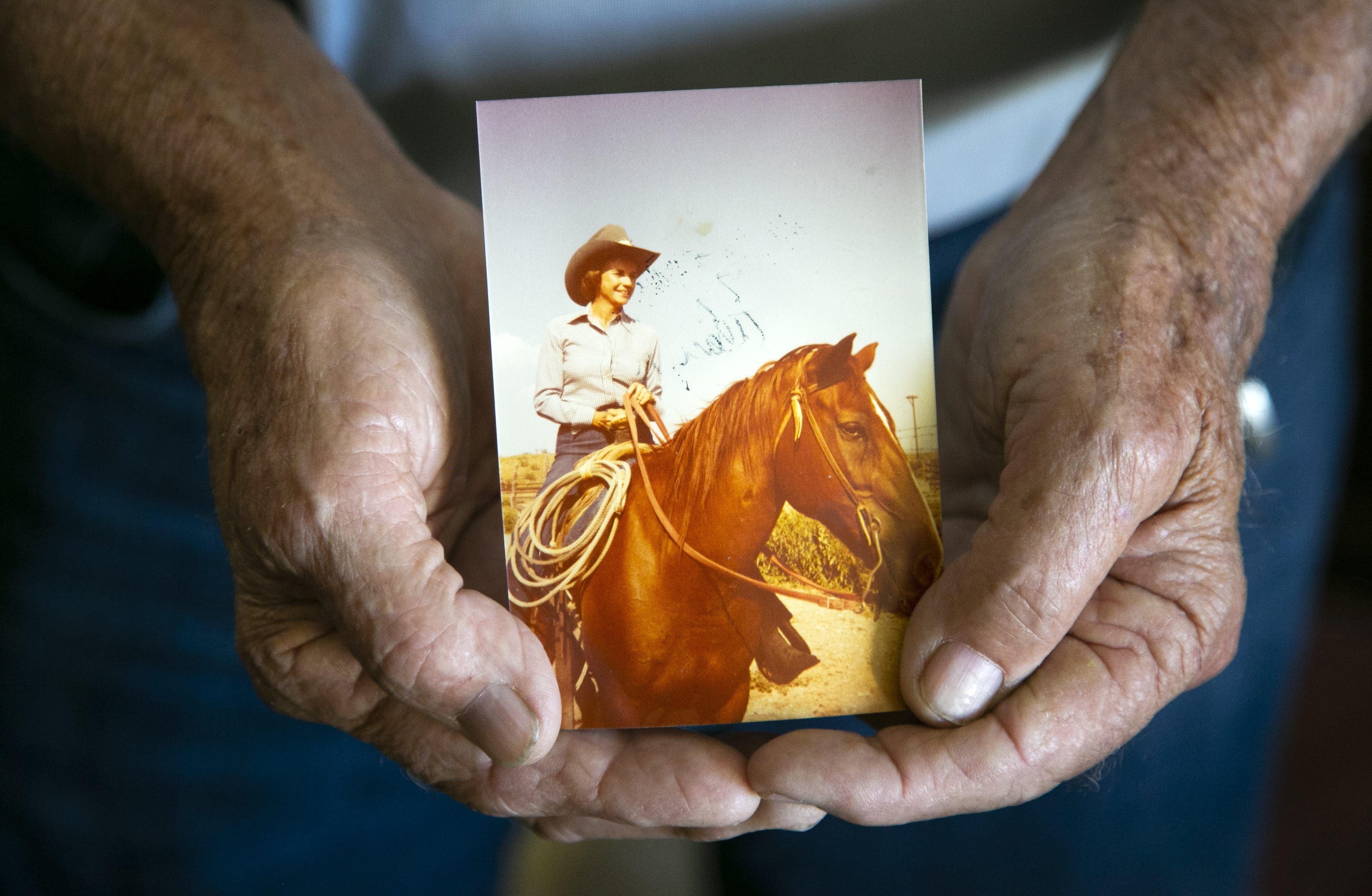 Alan Day, the brother of former Supreme Court Justice Sandra Day O'Connor, holds a photo his sister riding her favorite horse, "Chico," at the Lazy B Ranch outside of Duncan, Ariz., in the 1950s. Day was holding the photo at his Oro Valley home on Nov. 1, 2018. Former Supreme Court Justice Sandra Day O'Connor grew up on the cattle ranch.