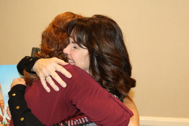 Nancy Ponte, left, hugs Janis Drexler at a gathering organized by Donor Network West on Dec. 27, 2018 in California.