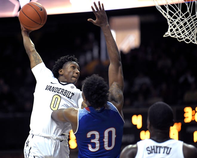 Vanderbilt guard Saben Lee (0) dunks the ball over Tennessee State forward Stokley Chaffee Jr. (30) during a at Memorial Gym in Nashville on Saturday, Dec. 29, 2018.
