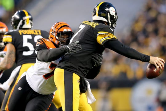Former Ragin' Cajuns defensive lineman Christian Ringo, left, pressures Pittsburgh Steelers quarterback Ben Roethlisberger when Ringo played for the Cincinnati Bengals in 2018. Ringo is now with the New Orleans Saints.