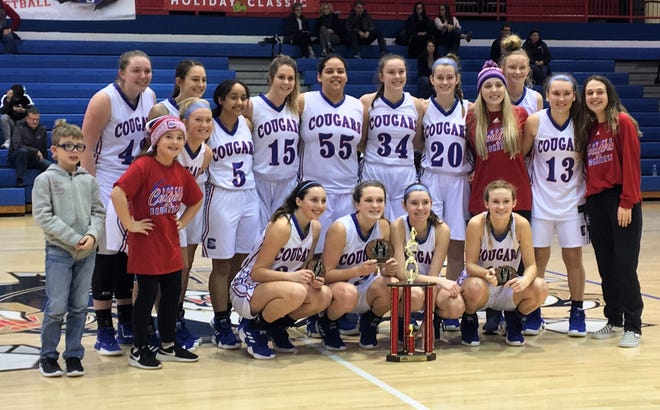 Conner with its tournament championship trophy during Conner's 54-46 overtime win over Highlands in girls basketball in the finals of Conner's LaRosa's Holiday Classic Dec. 29, 2018, Hebron KY.