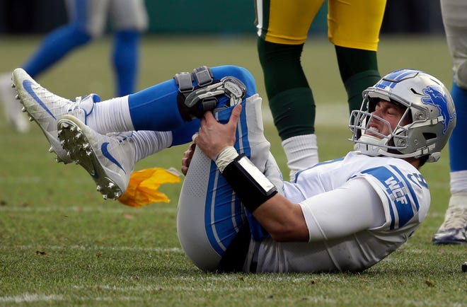 Lions quarterback Matthew Stafford reacts after being hit late by the Packers' Fadol Brown in the second half.