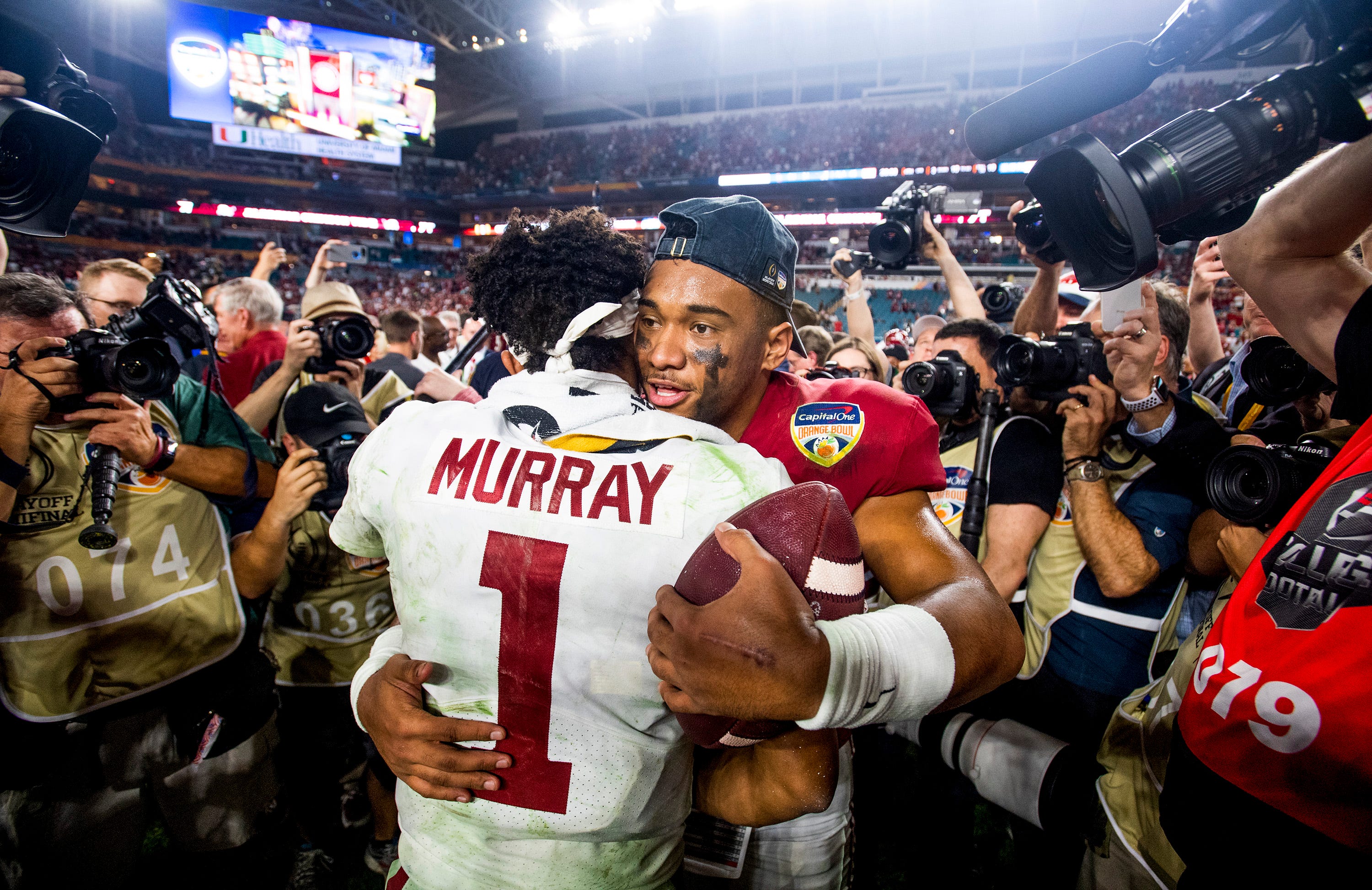 Heisman winner Murray, runnerup Tua battle evenly in Orange Bowl