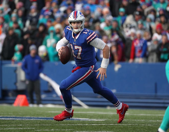 Buffalo Bills quarterback Josh Allen  rolls outside of the pocket during Sunday's win over the Miami Dolphins. Allen has been named AFC Offensive Player of the Week.