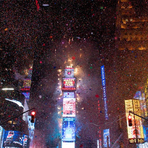 The ball drops to enter in the new year during...