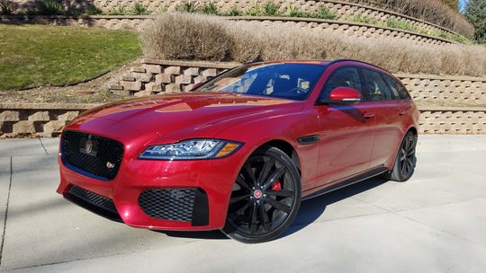 Compared to the Mercedes, the Jaguar XF Sportbrake's interior feels dated with a slow screen and plain layout. The pop-up, rotary shifter adds a touch of class.