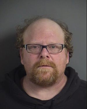 Police arrested David Russell Watt, 46, after he allegedly lit his partner's hair on fire twice and pushed her to the ground Sunday night, Dec. 30, 2018.