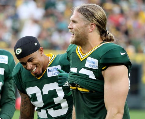 Green Bay Packers linebacker Clay Matthews (52) and cornerback Jaire Alexander (23) laugh during Green Bay Packers Family Night Saturday, August 4, 2018 at Lambeau Field in Green Bay, Wis.,