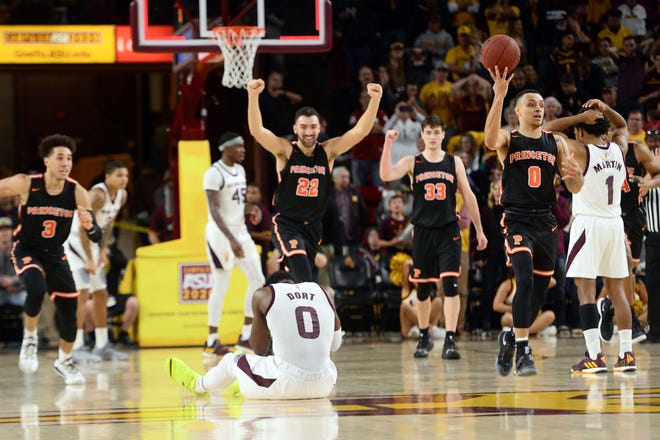 Arizona State guard Luguentz Dort (0) reacts as Princeton players celebrate a 67-66 victory over the Sun Devils on Dec. 29 at Wells Fargo Arena.