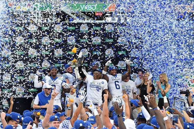 The Kentucky Wildcats celebrate after defeating the Penn State Nittany Lions in the 2019 Citrus Bowl at Camping World Stadium on Tuesday, Jan. 1, 2019, in Orlando, Florida.