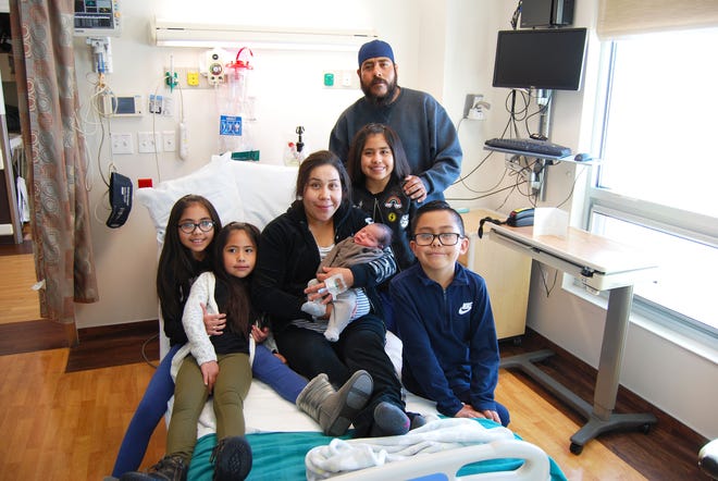 Jesus Uribe Orozco and family are photographed after he was named "Baby New Year" at the Cedar City Hospital. He was born early in the morning, Jan. 2, becoming the first baby delivered in the new year at the hospital.