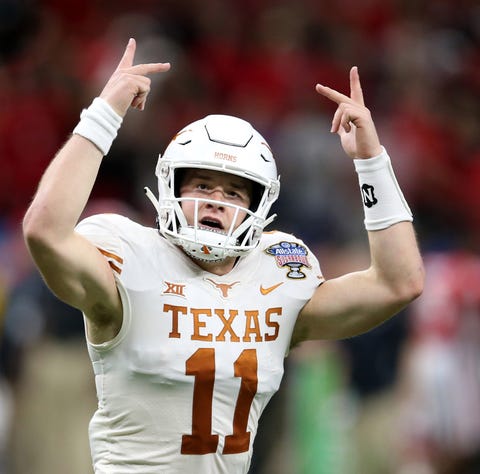 Texas Longhorns quarterback Sam Ehlinger (11)...