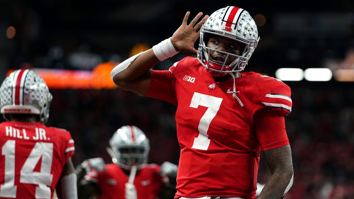 Ohio State Buckeyes quarterback Dwayne Haskins (7) celebrates with teammates after throwing a touchdown pass against the Northwestern Wildcats in the first half in the Big Ten conference championship game at Lucas Oil Stadium.
