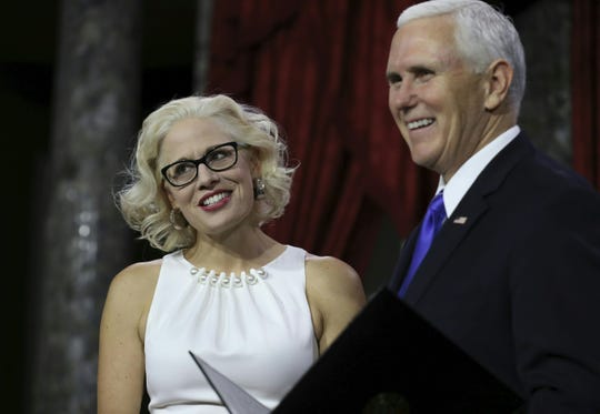 Kyrsten Sinema is sworn in by Vice President Mike Pence during the swearing-in re-enactments for recently elected senators in the Old Senate Chamber on Capitol Hill on Jan. 3, 2019.
