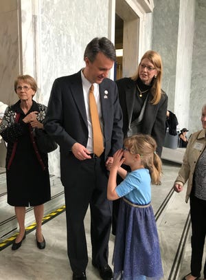 Congressman Ben Cline holds his daughter's hand as they greet constituents from the 6th district of Virginia.
