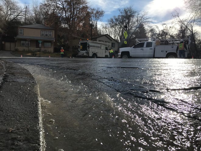 Water flows along California Avenue at Forson Drive in Old Southwest Reno on Friday morning.