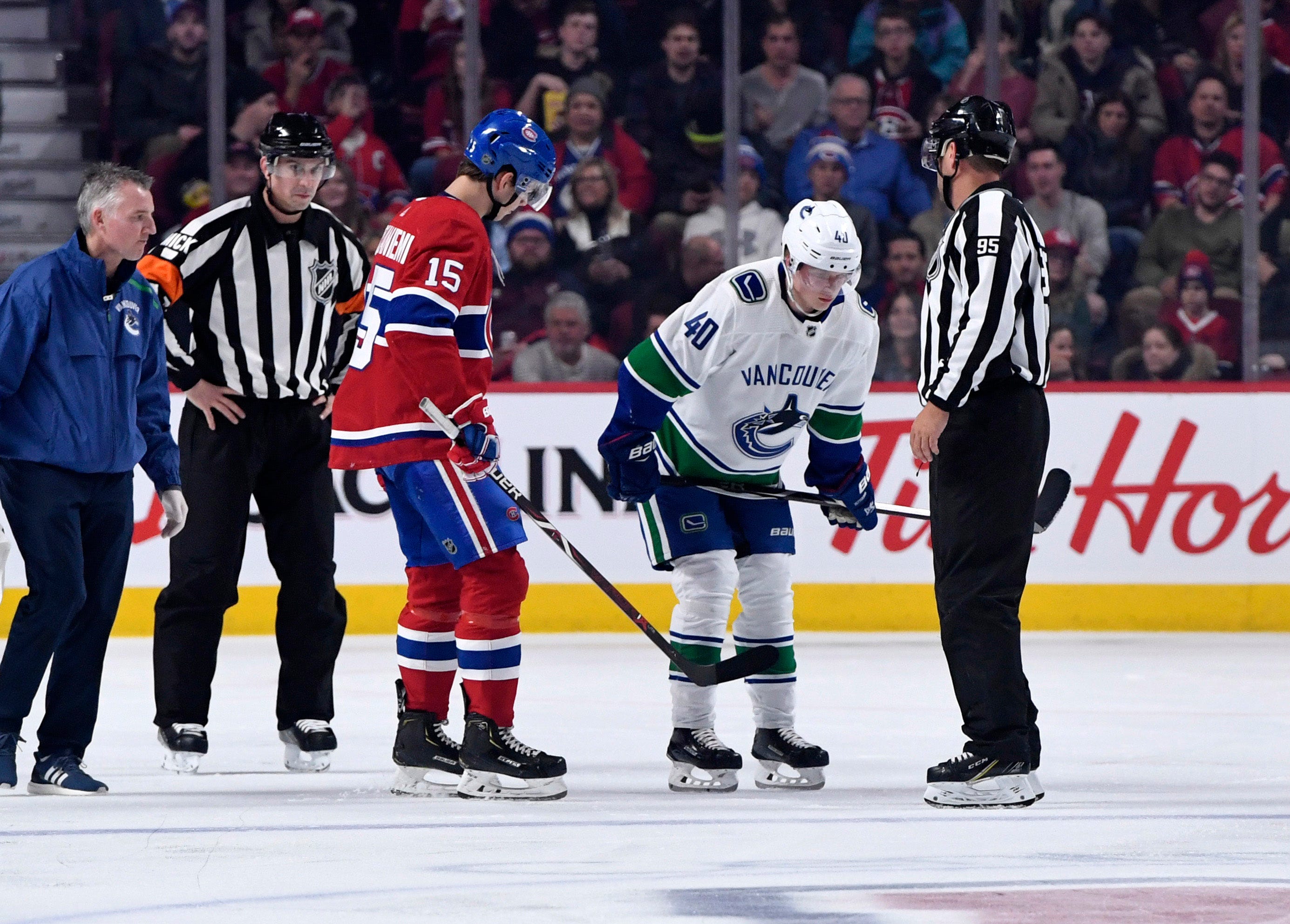 NHL rookie leader Elias Pettersson suffers injury in awkward collision