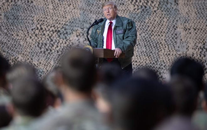 President Donald Trump on the Al Asad Air Base in Iraq, December, 2018. Among veterans and military families across the United States, there are sharply mixed feelings about the new reports that Trump made multiple disparaging comments about the U.S. military.