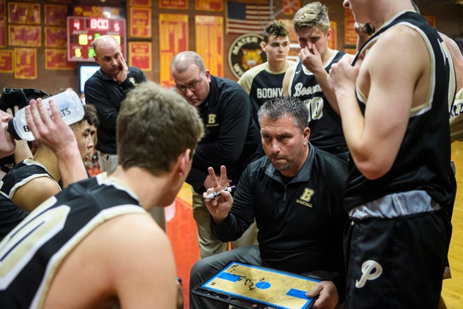 Boonville Head Coach Brian Schoonover talks to his team before the start of the second quarter against Mater Dei Wildcats. Schoonover announced his resignation after two seasons.