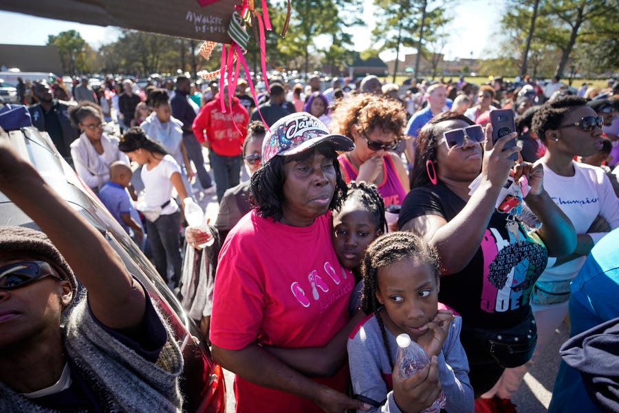 People attend a community rally for seven-year-old Jazmine Barnes in Houston on Saturday, Jan. 5, 2019.