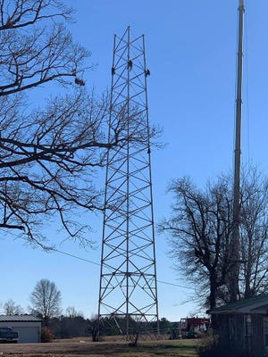 Workers construct a new cell tower in the Walnut Grove community of Hardin County. The tower, owned by Vertical Bridge, can host up to four cell service carriers.