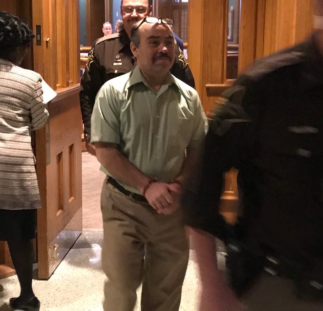 Franco Navarrete is escorted from the courtroom Monday morning during jury selection for his murder trail. He is accused of killing his mother-in-law and brother-in-law on Aug. 10, 2017.