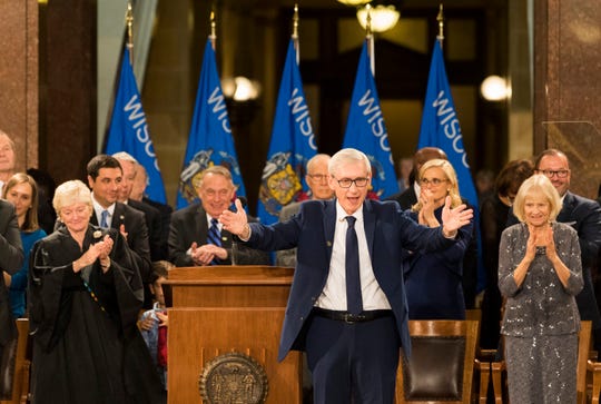 Newly sworn-in Gov. Tony Evers acknowledges the crowd during the inauguration.