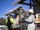 Brandon Torres (center), the Branch Chief of Emergency Services at Grand Canyon National Park, directs guests in the park on Jan. 4, 2019. The park was staffed at minimum capacity due to the government shutdown but retained much of its services due to an executive order issued by Arizona Governor Doug Ducey to run the park with state funds in the event of a shutdown. 