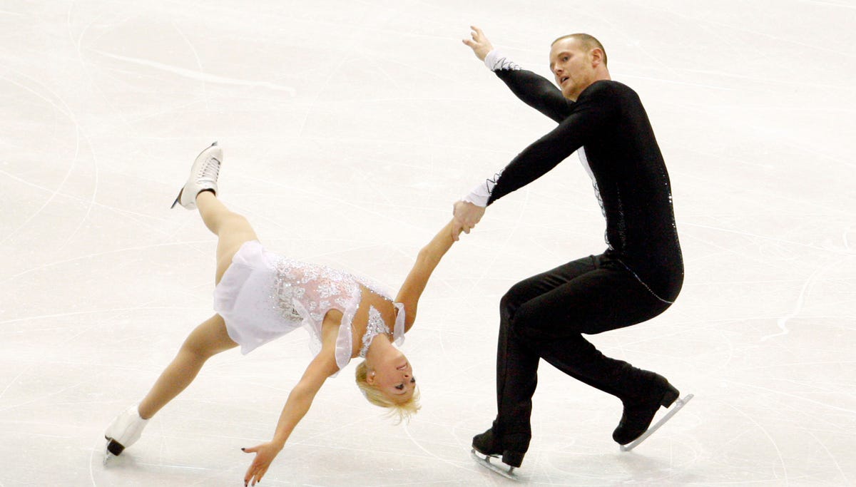 John Coughlin, shown with pairs partner Caydee Denney, competes at the 2013 Skate America competition at Joe Louis Arena.